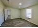 Bedroom features gray wood-look flooring, fresh paint, and bright natural light at 9161 Codel Loop, New Port Richey, FL 34654