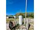 Water tank and utility access points with a view of the home in the background at 9161 Codel Loop, New Port Richey, FL 34654