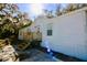 Charming one-story home boasts a wooden porch, white siding and sunny curb appeal at 9161 Codel Loop, New Port Richey, FL 34654