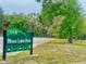 Entrance sign for Pasco County's Moon Lake Park surrounded by lush Florida greenery and shade trees at 9161 Codel Loop, New Port Richey, FL 34654
