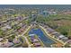 Panoramic view of the community showcasing homes nestled among trees and waterways at 9398 N Burnam Dr, Weeki Wachee, FL 34613