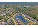 Gorgeous aerial view of a waterfront community with lush landscaping and serene lakes surrounding homes at 9398 N Burnam Dr, Weeki Wachee, FL 34613