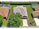 A bird's eye view shows a well-maintained roof, landscaping, and a pool in the neighborhood at 9398 N Burnam Dr, Weeki Wachee, FL 34613