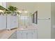 Beautiful bathroom with double sinks, a vanity, and a large mirror provides ample space at 9398 N Burnam Dr, Weeki Wachee, FL 34613