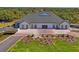 Aerial photo of clubhouse featuring well-manicured lawn and a paved circular driveway at 9398 N Burnam Dr, Weeki Wachee, FL 34613