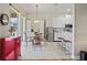 Bright dining area featuring stainless steel appliances, bar seating, and modern lighting at 9398 N Burnam Dr, Weeki Wachee, FL 34613