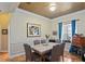 Dining room with a marble table, seating for six, and neutral paint is perfect for entertaining at 9398 N Burnam Dr, Weeki Wachee, FL 34613