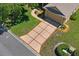 Aerial view of the house showing the driveway and well-kept lawn at 9398 N Burnam Dr, Weeki Wachee, FL 34613