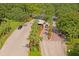 Aerial shot of a gated entrance lined with palm trees and manicured landscaping at 9398 N Burnam Dr, Weeki Wachee, FL 34613