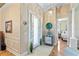 Elegant foyer with tile flooring, decorative lighting, and views of the bedroom and living areas at 9398 N Burnam Dr, Weeki Wachee, FL 34613