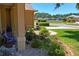 A picturesque view of the streetscape and landscaping from the covered porch at 9398 N Burnam Dr, Weeki Wachee, FL 34613