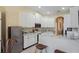 Kitchen featuring stainless steel appliances, granite countertops, and white cabinets at 9398 N Burnam Dr, Weeki Wachee, FL 34613