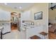Kitchen featuring white cabinets, granite countertops, and stainless steel appliances at 9398 N Burnam Dr, Weeki Wachee, FL 34613
