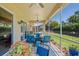 Enclosed patio featuring comfortable seating and serene views of the private yard and pool at 9398 N Burnam Dr, Weeki Wachee, FL 34613