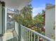View from balcony overlooking a well-manicured garden with lush greenery and a tranquil ambiance at 946 Highland Ave # 47, Dunedin, FL 34698