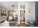 Open-concept dining area leads into a bathroom with vanity, toilet and neutral wall colors at 946 Highland Ave # 47, Dunedin, FL 34698