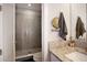 Bathroom with granite countertop, undermount sink, and walk-in shower at 946 Highland Ave # 47, Dunedin, FL 34698