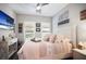 Inviting bedroom with a cozy bed, decorative pillows, and serene decor, offering a peaceful retreat at 946 Highland Ave # 47, Dunedin, FL 34698