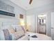 Cozy bedroom with a stylish bed and easy access to the en-suite bathroom, ensuring comfort and convenience at 946 Highland Ave # 47, Dunedin, FL 34698