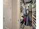 Organized walk-in closet with clothing racks and shoe shelves for ample storage at 946 Highland Ave # 47, Dunedin, FL 34698