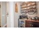 Home coffee bar showcasing shelving, a coffee maker, and a mini-fridge filled with beverages at 946 Highland Ave # 47, Dunedin, FL 34698