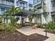 Inviting outdoor community area featuring a swing and lounge chairs at 946 Highland Ave # 47, Dunedin, FL 34698