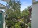 Aerial view of the courtyard, featuring lush greenery, walking paths, and building views at 946 Highland Ave # 47, Dunedin, FL 34698
