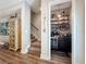 Hallway view showcasing a staircase and coffee bar with beverage fridge and decorative shelving at 946 Highland Ave # 47, Dunedin, FL 34698