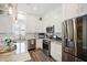 Bright kitchen showcasing white cabinetry, stainless steel appliances, and a stylish subway tile backsplash at 946 Highland Ave # 47, Dunedin, FL 34698