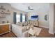 Bright and airy living room with hardwood floors, comfortable seating, and large windows at 946 Highland Ave # 47, Dunedin, FL 34698