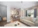 Inviting living room with neutral tones, hardwood floors, and open concept to the dining area at 946 Highland Ave # 47, Dunedin, FL 34698