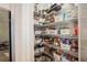 Organized walk-in pantry with wire shelving and labeled storage bins for convenient food storage and access at 946 Highland Ave # 47, Dunedin, FL 34698