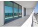 Balcony with glass railings offers stunning views of the water and city skyline at 100 1St N Ave # 3104, St Petersburg, FL 33701