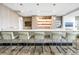 Contemporary bar with sleek white countertop, pendant lighting, and comfortable seating at 100 1St N Ave # 3104, St Petersburg, FL 33701