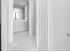 Bright bathroom featuring white marble floors, modern vanity, and a view of the ocean at 100 1St N Ave # 3104, St Petersburg, FL 33701