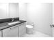 Modern bathroom with sleek vanity, toilet, and tile flooring at 100 1St N Ave # 3104, St Petersburg, FL 33701