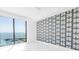 Modern bedroom with a textured accent wall and ocean view at 100 1St N Ave # 3104, St Petersburg, FL 33701