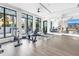 Bright gym with modern exercise equipment, mirrored walls, and city views at 100 1St N Ave # 3104, St Petersburg, FL 33701