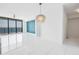 Contemporary living room featuring floor-to-ceiling windows with ocean views, and artistic blue accent wall at 100 1St N Ave # 3104, St Petersburg, FL 33701