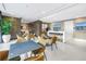 Contemporary lounge space with tables, chairs, and a view of the city at 100 1St N Ave # 3104, St Petersburg, FL 33701
