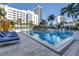 Inviting pool area with clear blue water, comfortable lounge chairs and hotel backdrop for ultimate relaxation at 100 1St N Ave # 3104, St Petersburg, FL 33701