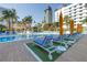 Resort-style pool with blue lounge chairs and sunny umbrellas for relaxation at 100 1St N Ave # 3104, St Petersburg, FL 33701