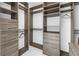 Spacious walk-in closet with gray wood shelving and drawers for optimal storage at 100 1St N Ave # 3104, St Petersburg, FL 33701