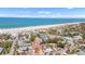 Stunning aerial view of the home and neighborhood, showcasing proximity to the beach and the Gulf at 1008 Mandalay Ave, Clearwater, FL 33767