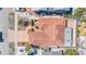 Aerial view of a charming single-story home with a terra cotta roof, a courtyard, and paved driveway at 1008 Mandalay Ave, Clearwater, FL 33767