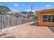 Spacious backyard featuring a concrete walkway, gravel landscaping and a wooden fence at 1008 Mandalay Ave, Clearwater, FL 33767