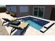 Inviting backyard pool area with lounge chairs, perfect for relaxation and outdoor enjoyment at 1008 Mandalay Ave, Clearwater, FL 33767