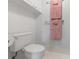 A clean and well-lit bathroom with a white toilet and towel racks at 108 Lakeview Ct # 108, Oldsmar, FL 34677