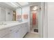Bright bathroom with white vanity and access to toilet area at 108 Lakeview Ct # 108, Oldsmar, FL 34677