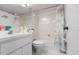 Clean bathroom features a tub/shower combo with white tile, a sink and decorative dolphin-themed elements at 108 Lakeview Ct # 108, Oldsmar, FL 34677
